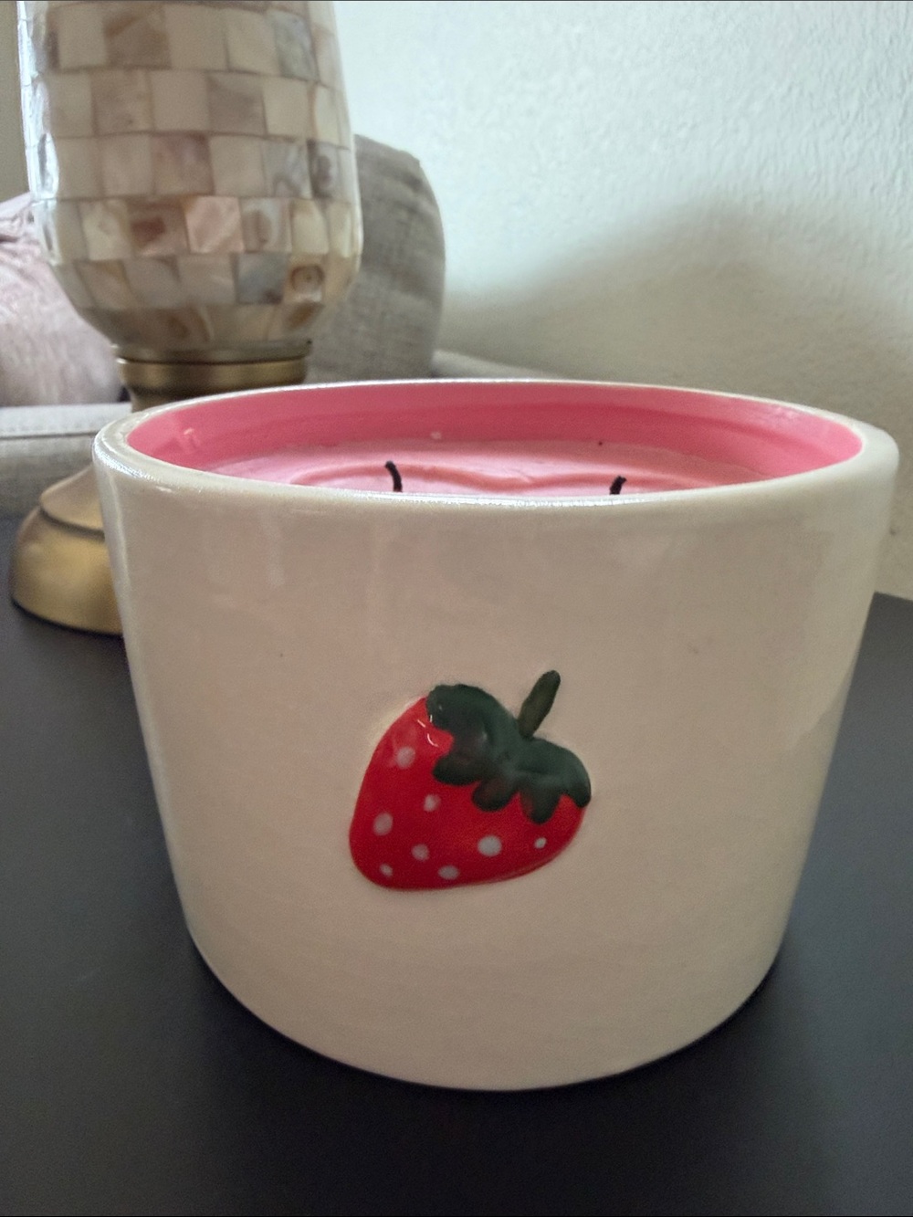 DW Home Cream Ceramic Strawberry Candle with Pink Wax- gently used 
About 19 oz